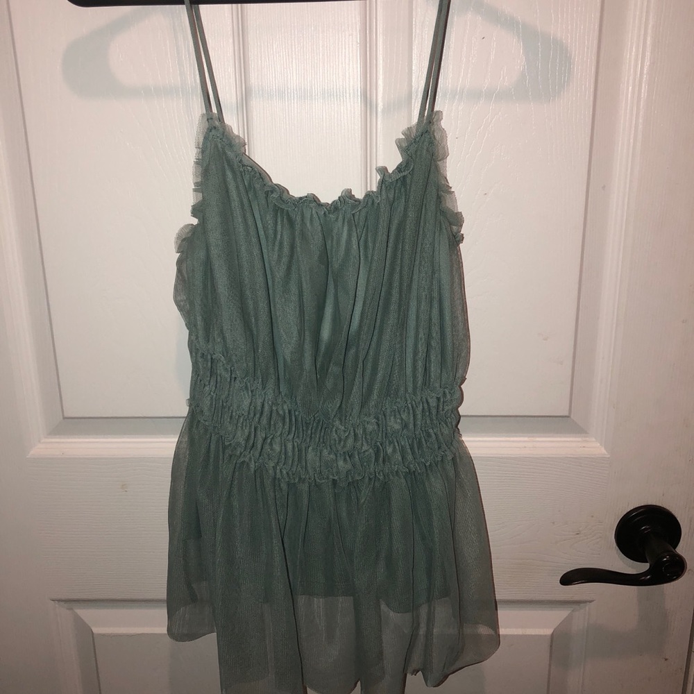 Aqua colored spaghetti strap shirt.